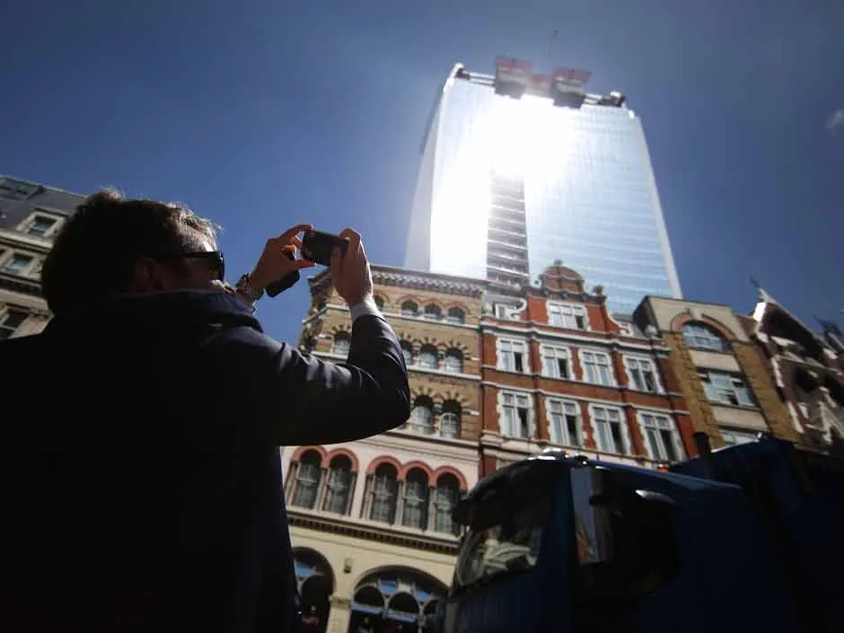 The Walkie-Talkie building at 20 Fenchurch Street in London reflecting intense sunlight, known as the Fryscraper